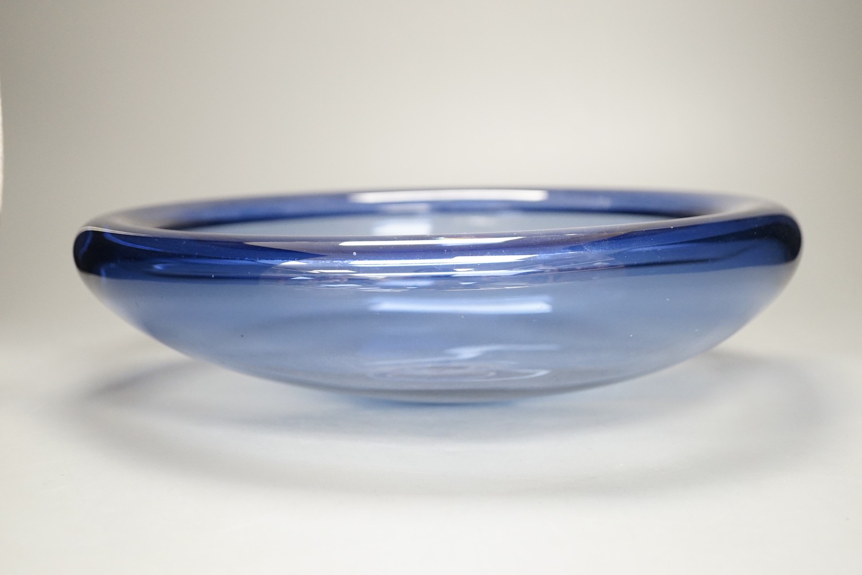 A Holmegaard blue glass bowl, signed and Numbered 17793, 34.5cm